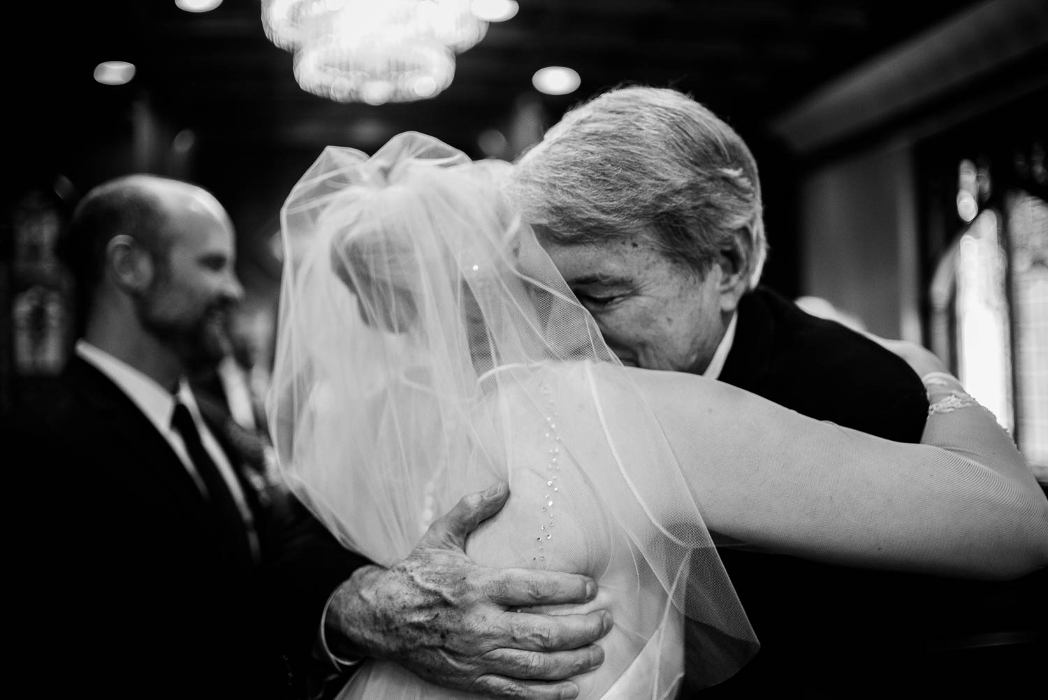 Father of bride shares an emotional hug irst United Methodist Church Wedding Houston