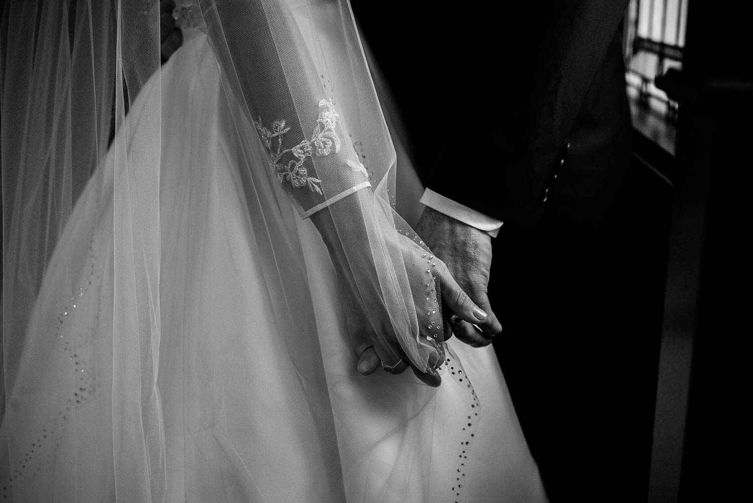 Couple holding hands at irst United Methodist Church Wedding Houston