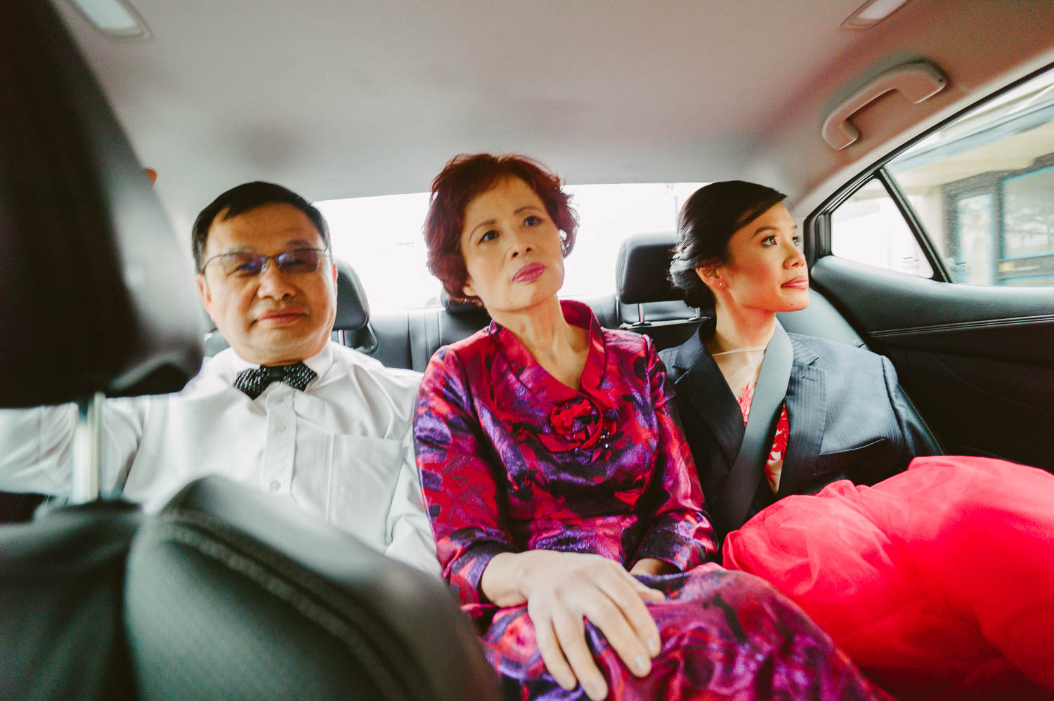 In the back of a car with bride and parents enroute from Hotel Havana -Leica photographer-Philip Thomas Photography