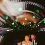 San Antonio wedding photographer capture Couple share a funny moment inside a limo with green sparkling lights Houston Texas en route to Brennan's of Houston, Texas.