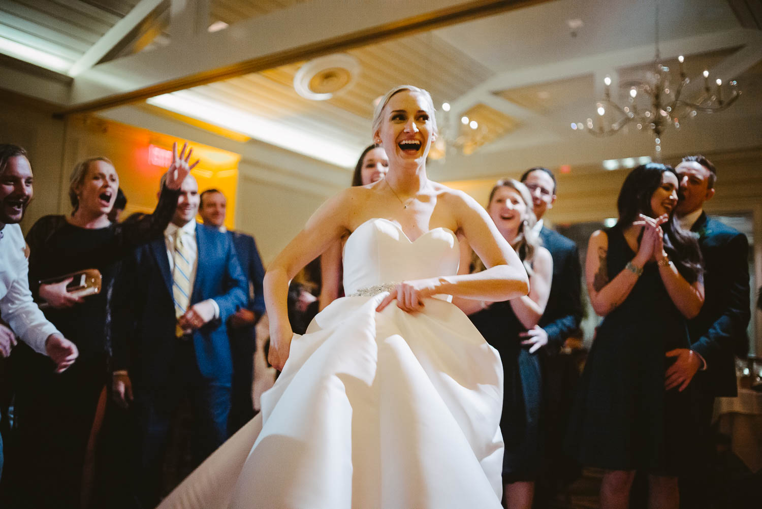 Bride during reception twists and turns on dance floor wedding reception Brennan's of Houston, Texas.