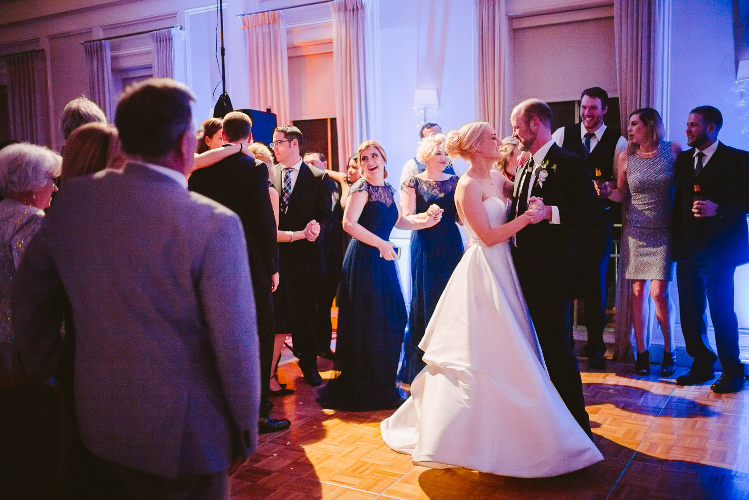 Wed couple on reception floor in joyful moment wedding reception Brennan's of Houston, Texas.