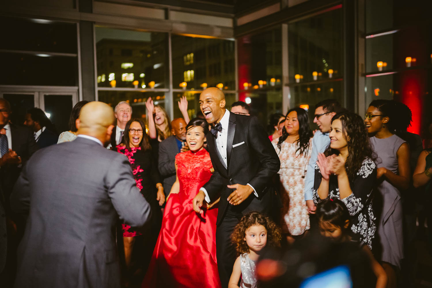 Katie and Owen are centered of the floor surrounded by family and friends at La Orilla Del Rio Ballroom-Leica photographer-Philip Thomas Photography