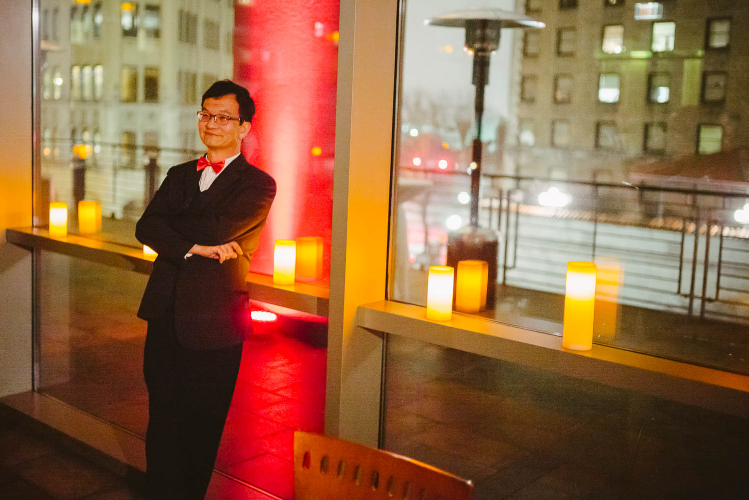 Family member from Taiwan looks on at wedding reception La Orilla Del Rio Ballroom-Leica photographer-Philip Thomas Photography