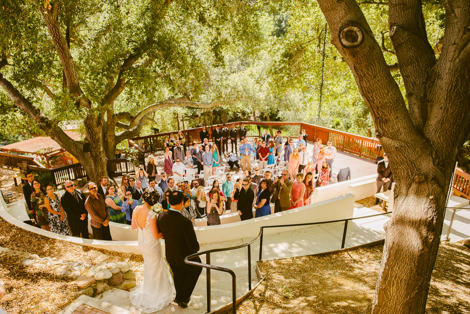 Bride and father walk down to the outdoor ceremony at1909 Topanga California Wedding-Leica-Philip Thomas