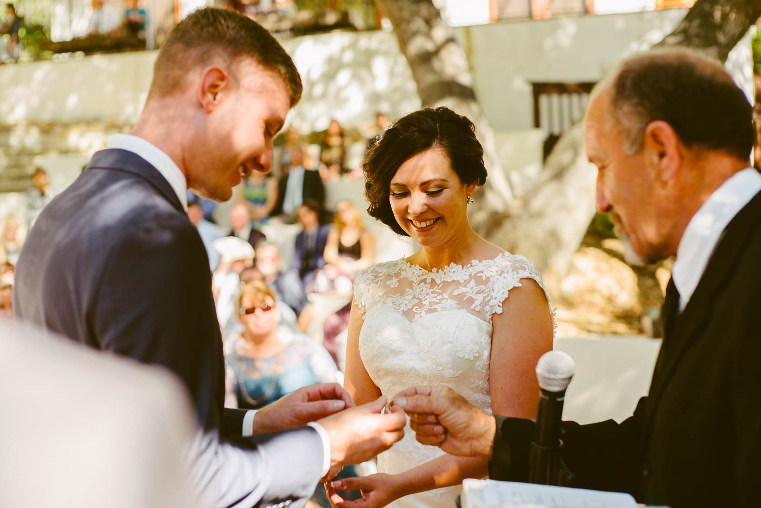 Groom places ring on brides hand at 1909 Topanga California Wedding-Leica-Philip Thomas