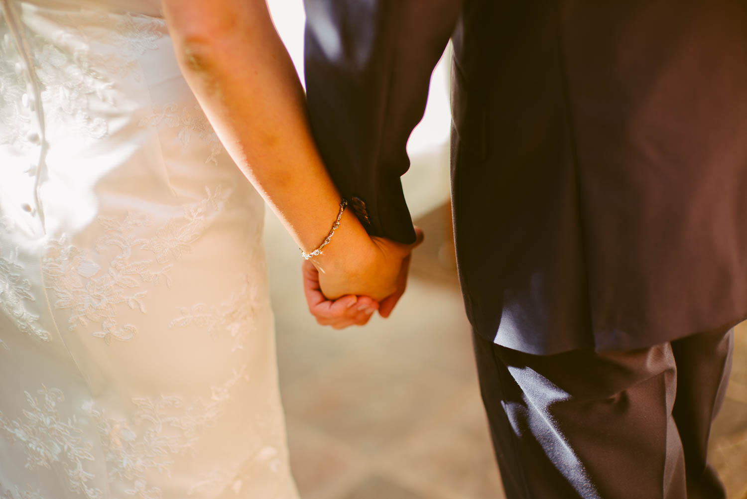 Bride and groom holding hands at 1909 Topanga California Wedding-Leica-Philip Thomas