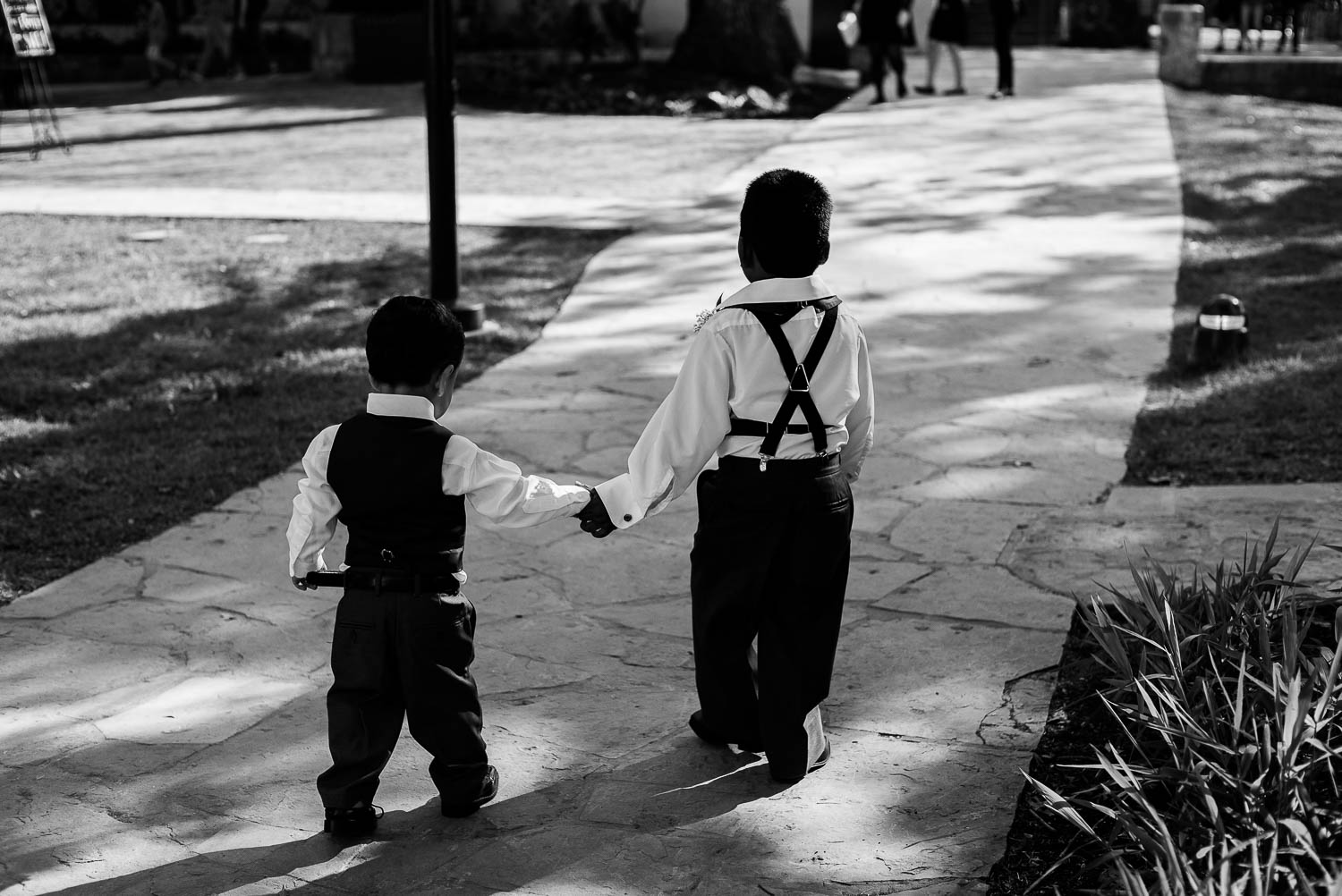 Ring bearers hold hands at The Witte Museum San Antonio Texas