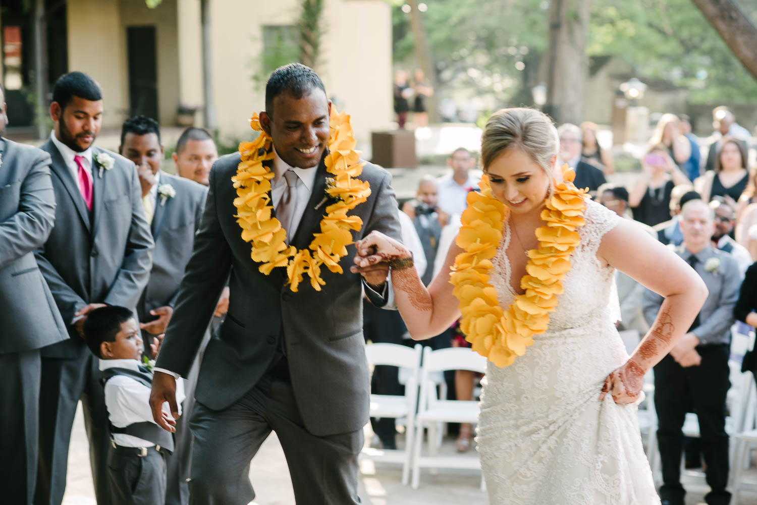 Bride and groom wedding ascend steps at The Witte Museum San Antonio Texas