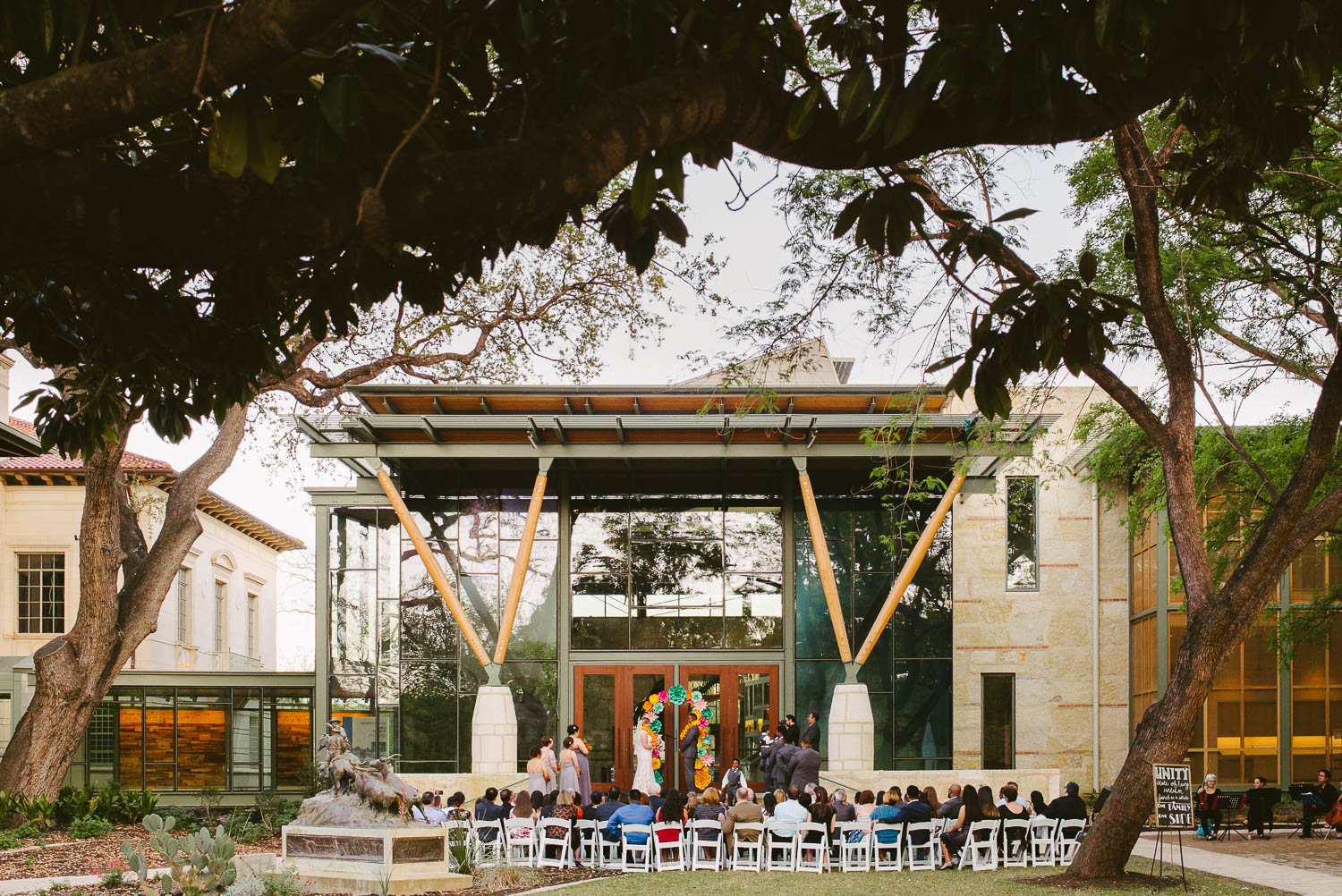 WIde angle shot of outdoor wedding ceremony at The-Witte_Museum-Leica-wedding-photographer-Philip Thomas Photography