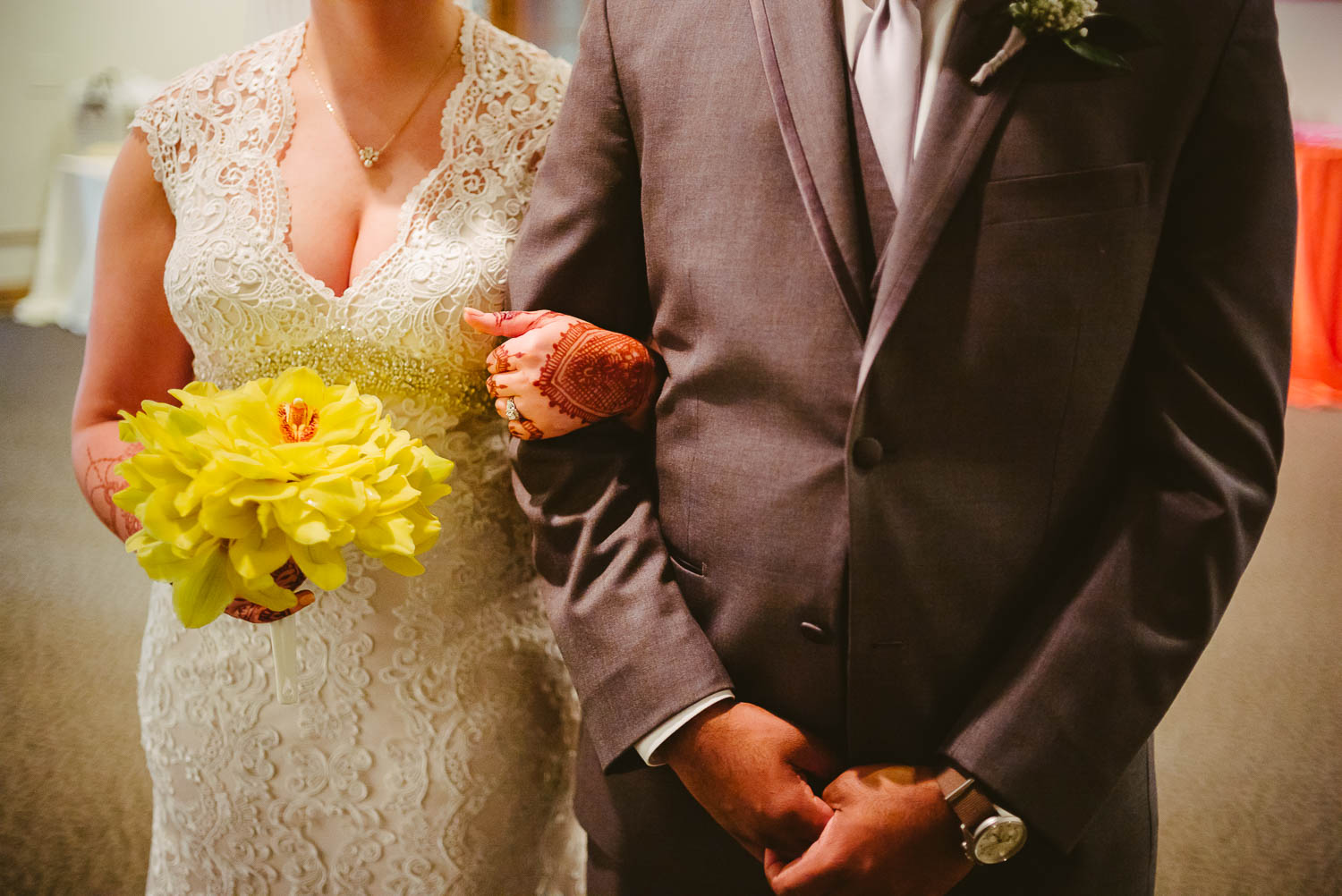 Image of brides and grooms arms locked moments before entering wedding reception at The-Witte_Museum-Leica-wedding-photographer-Philip Thomas Photography