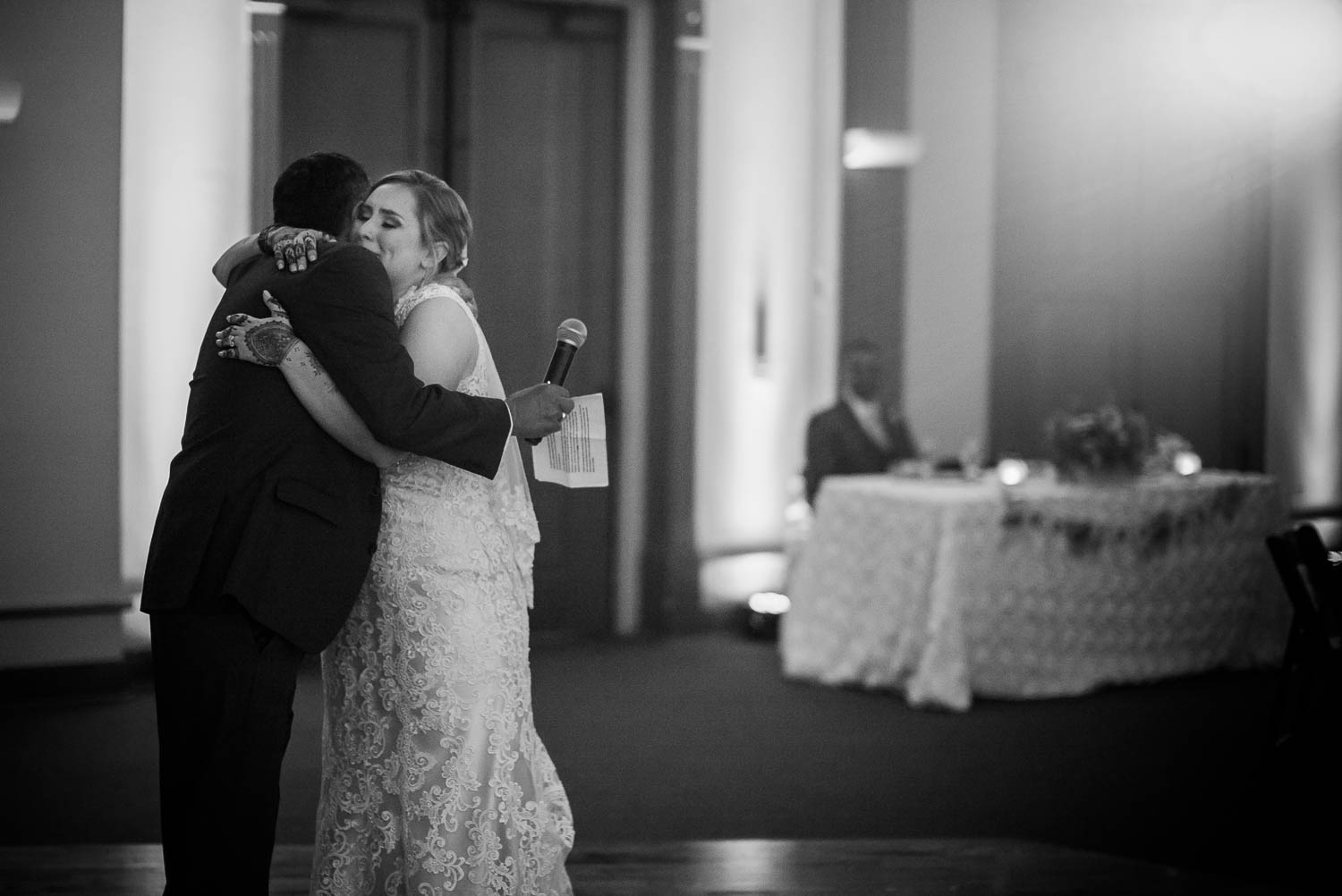 Bride of father hugs in an emotional toast The-Witte_Museum-Leica-wedding-photographer-Philip Thomas Photography