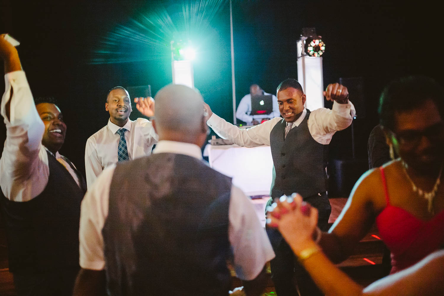Groom and friends dance at wedding reception The-Witte_Museum-Leica-wedding-photographer-Philip Thomas Photography