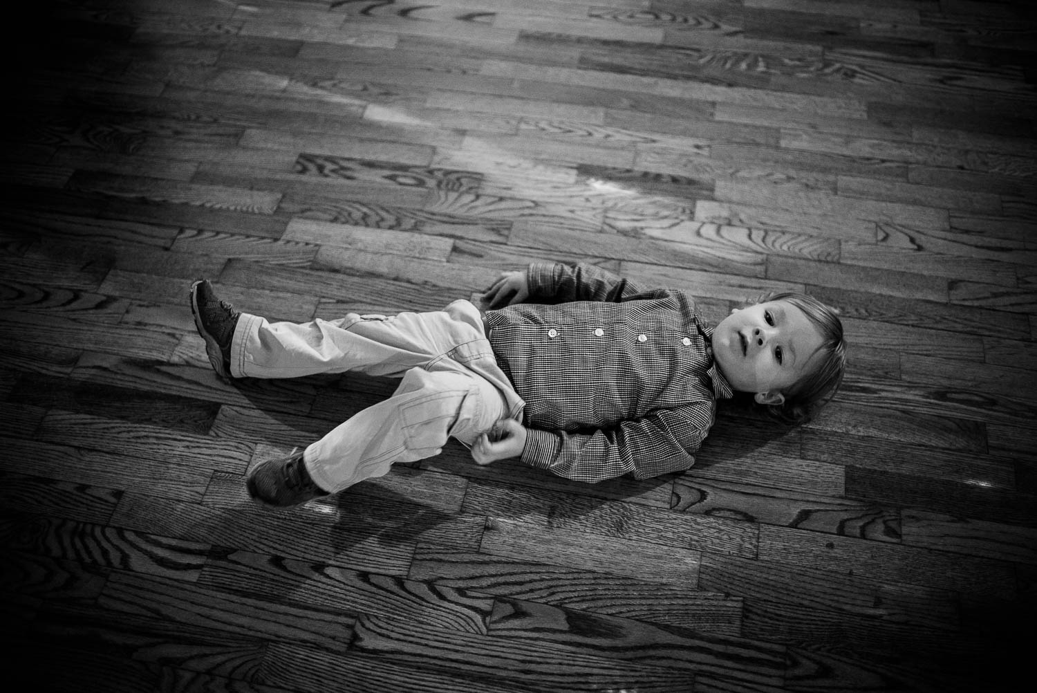 Little boy still on wedding reception floor at The-Witte_Museum-Leica-wedding-photographer-Philip Thomas Photography