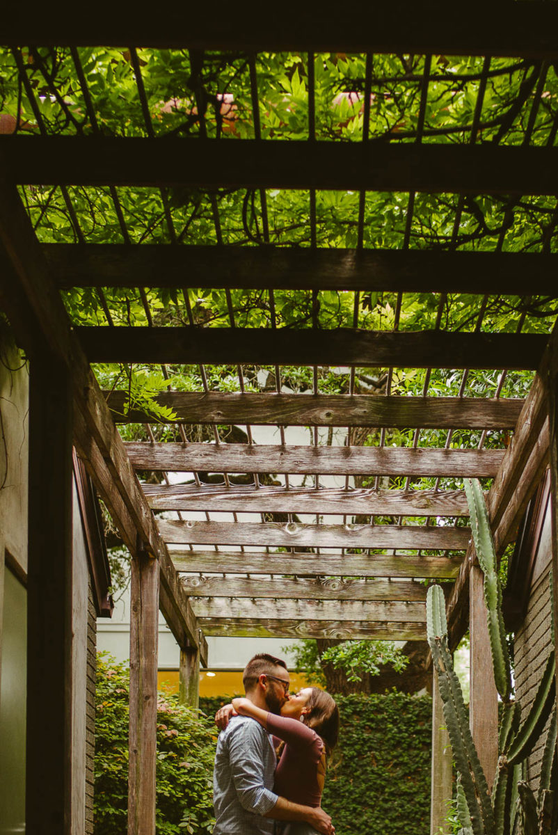 Couple at Hotel San Jose shows Trellis above heads-Austin Engagement Downtown