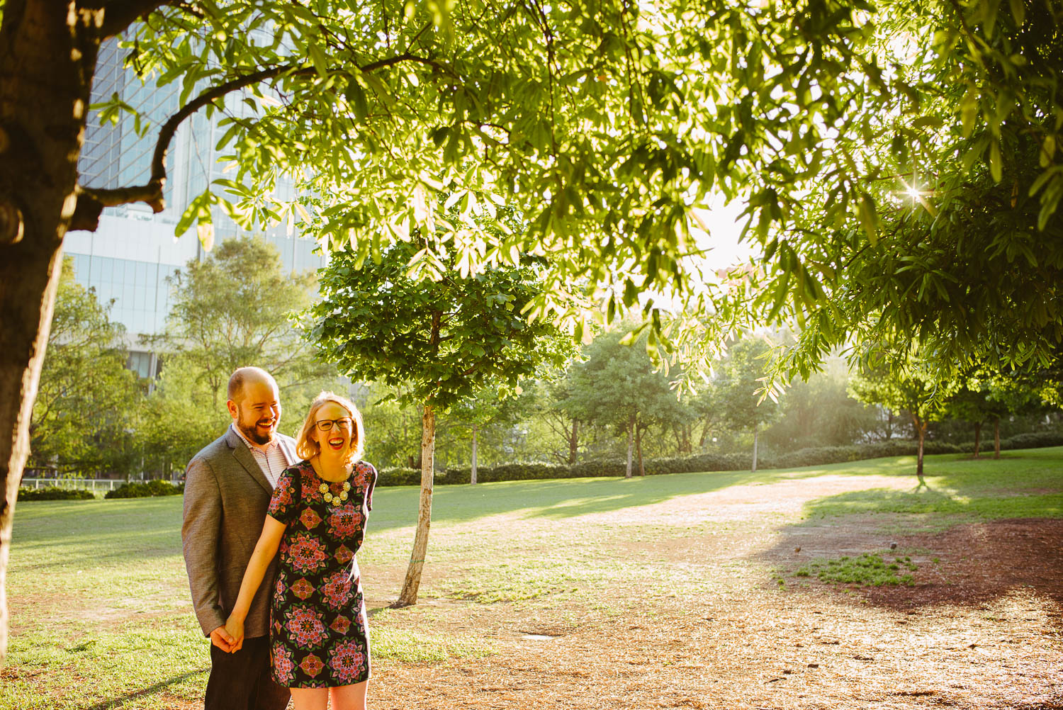 Couple hold hands at Discovery Green engagement shoot Houston Philip Thomas Photography