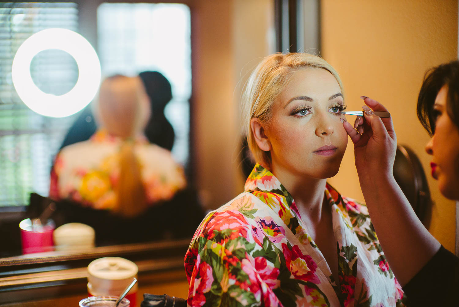 Finishing touches with make up for bride The Gardens of Old Town Helotes Hill Country Wedding