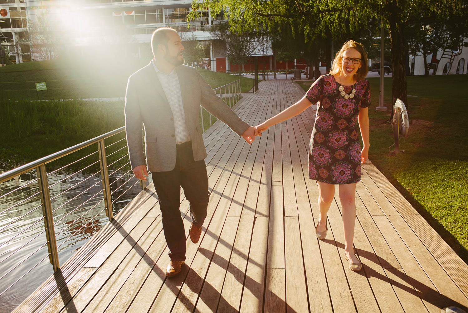 Couple stretch out at lake Discovery Green Houston Texas-Philip Thomas Photography