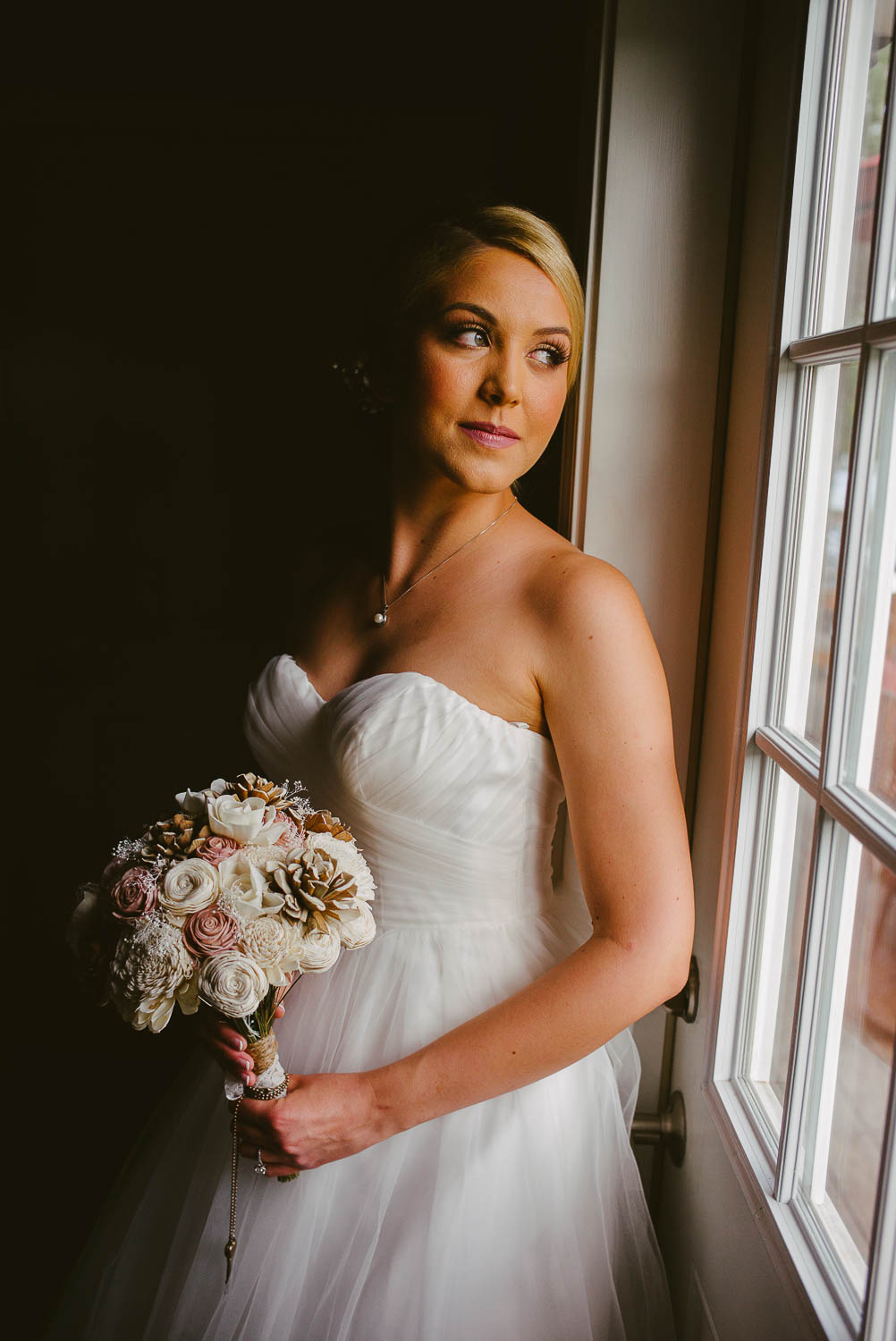 Sublime light falls on brides face in a posed portrait The Gardens of Old Town Helotes Hill Country Wedding