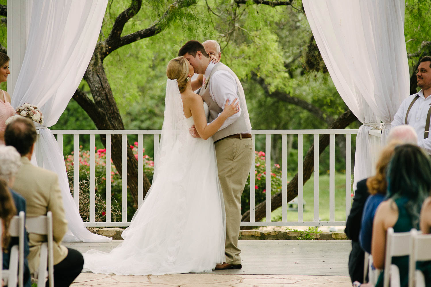 Couples first kiss The Gardens of Old Town Helotes Hill Country Wedding