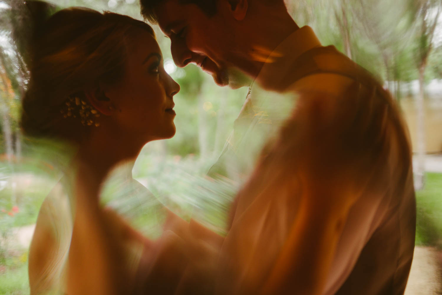 Couple closeup shot through window The Gardens of Old Town Helotes Hill Country Wedding