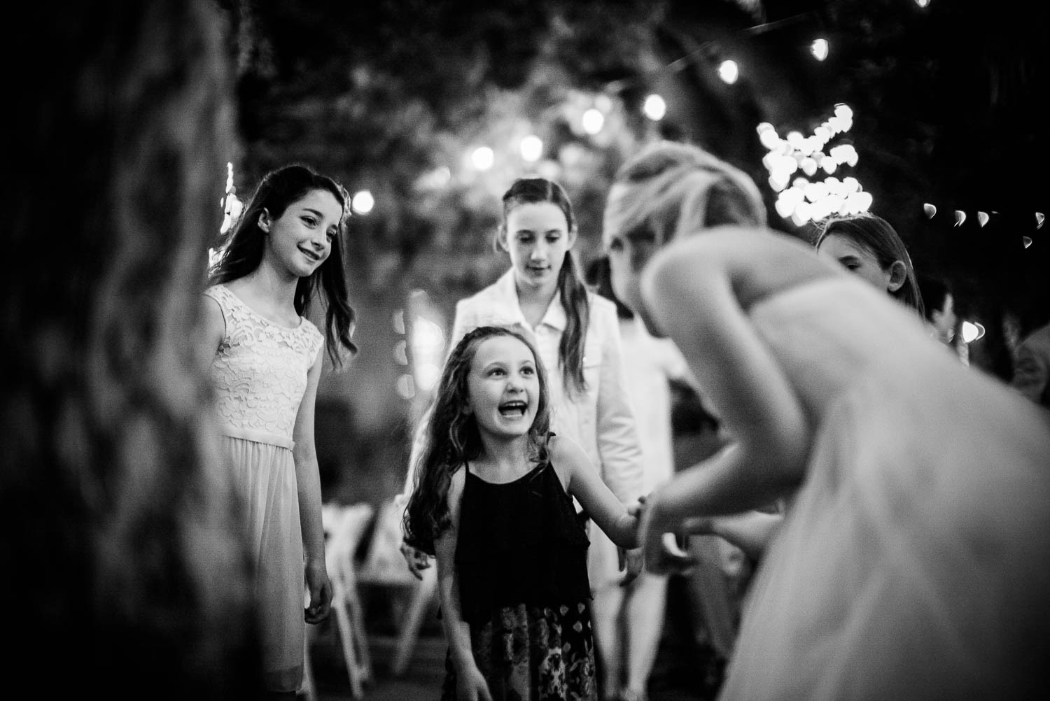 Beautiful reaction from girl dancing with the bride The Gardens of Old Town Helotes Hill Country Wedding
