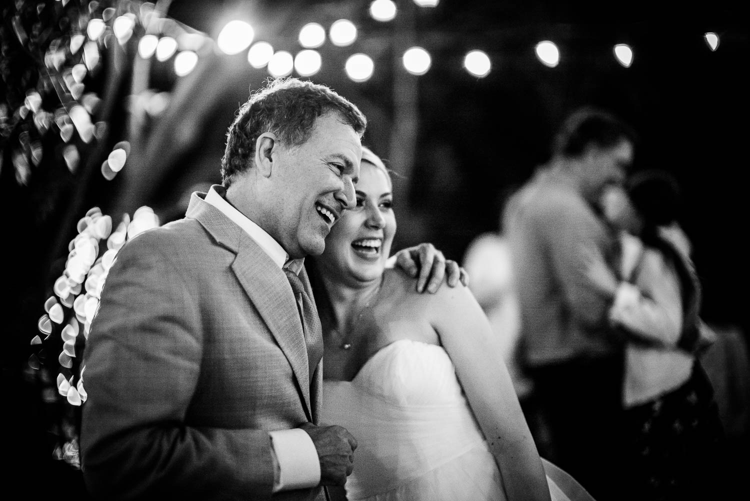 Father hugs his daughter during the first dance atThe Gardens of Old Town Helotes Hill Country Wedding