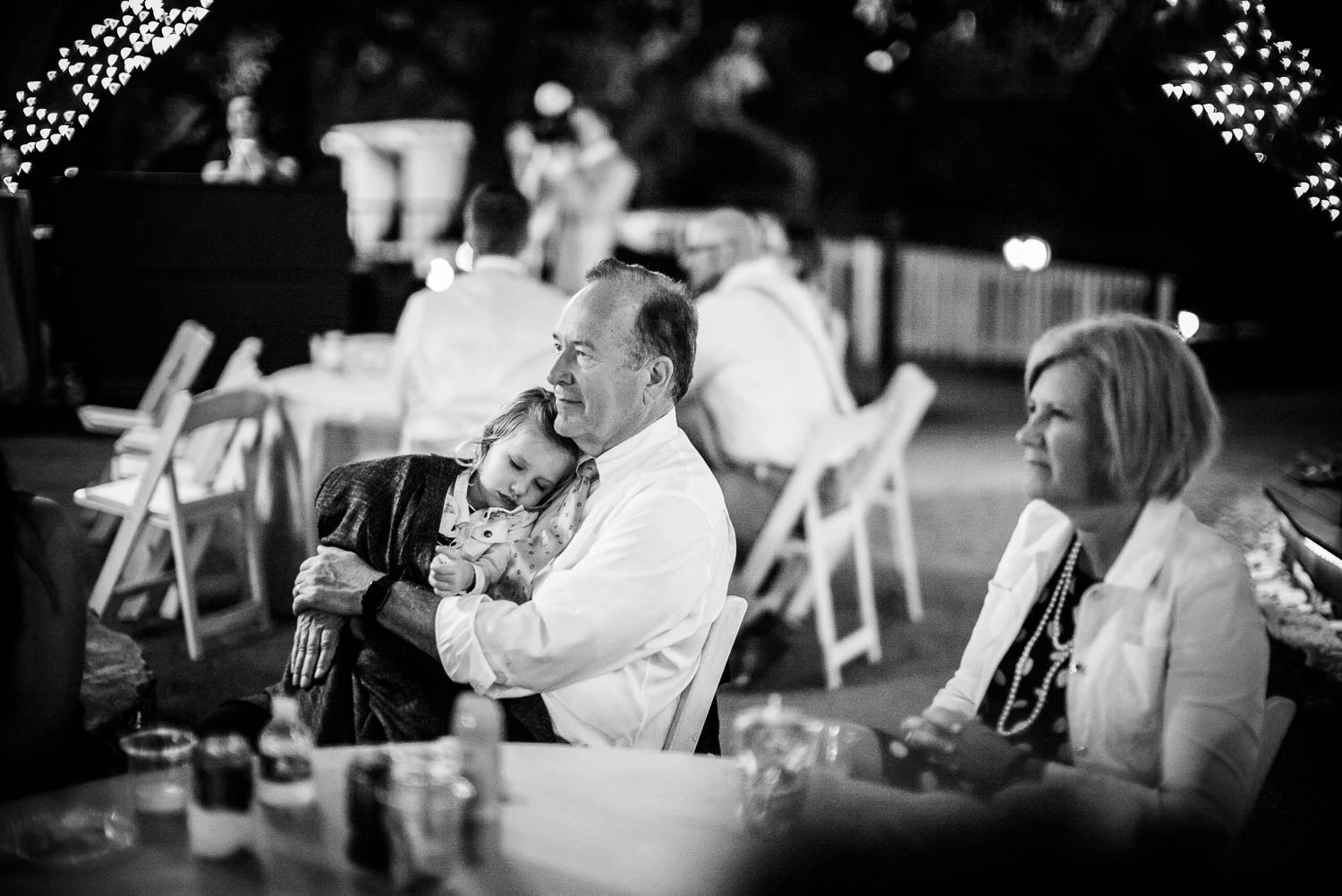 Little girl falls asleeo during wedding reception The Gardens of Old Town Helotes Hill Country Wedding