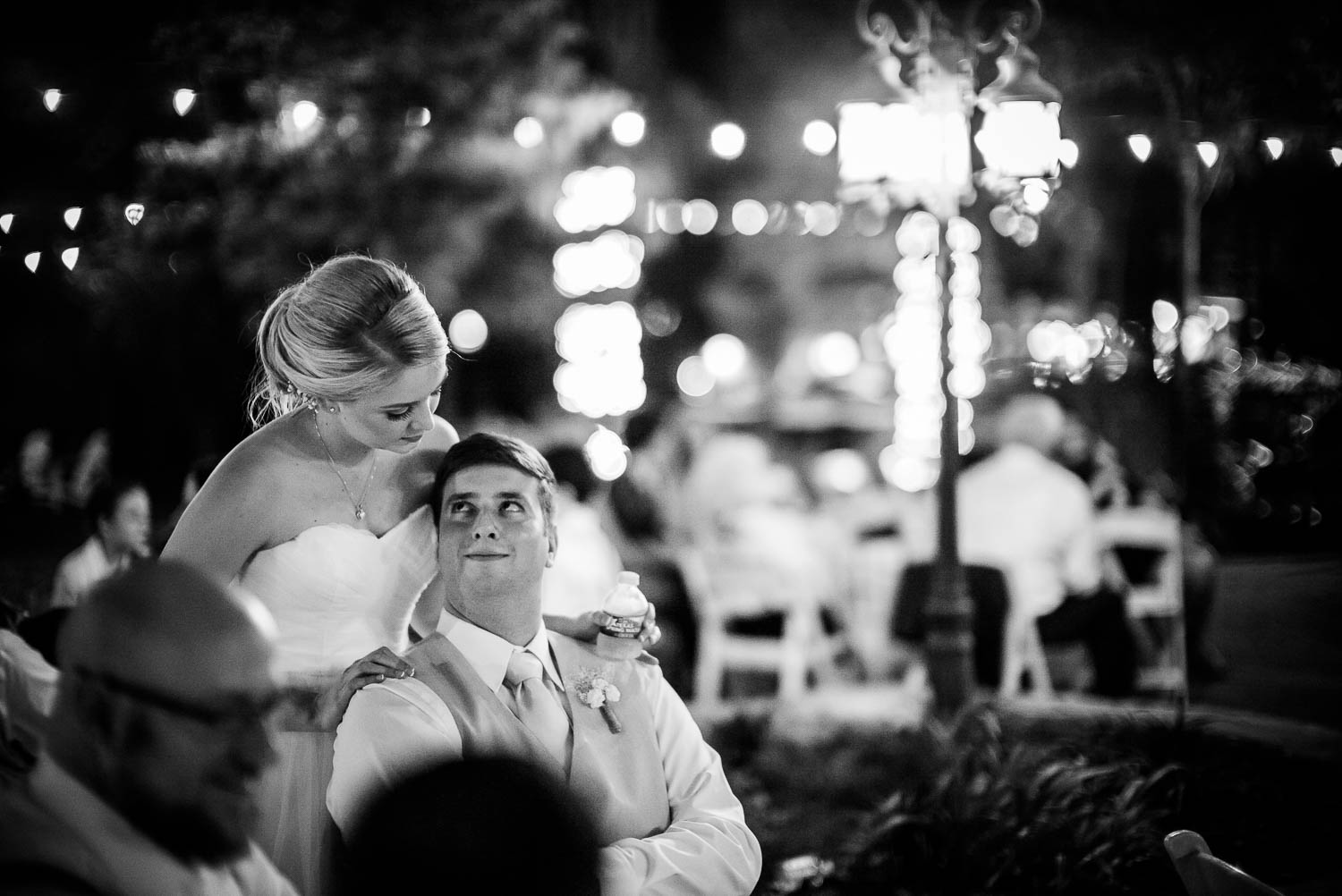 Jessica and Jeff look up at each other during wedding reception The Gardens of Old Town Helotes Hill Country Wedding
