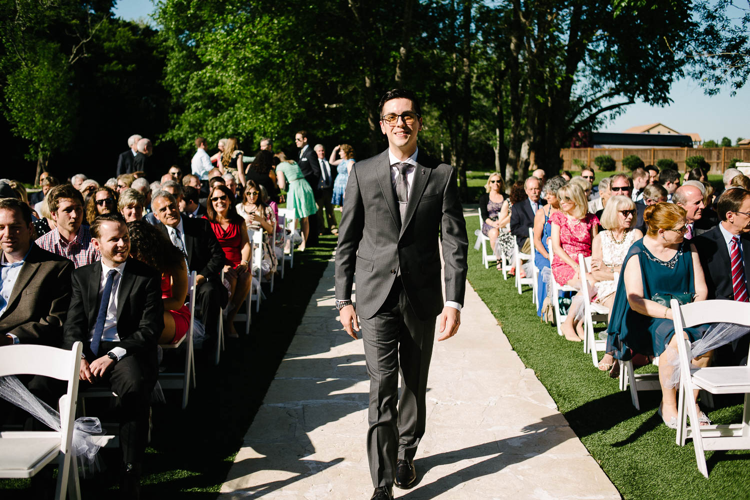 Groom walks down the aisle wedding Pecan Springs Houston Texas photo by Philip Thomas Photography