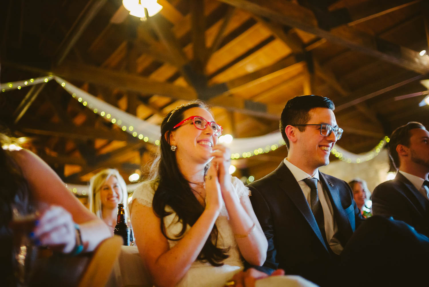 Reaction of bride and groom during wedding reception toasts Pecan Springs Houston Texas photo by Philip Thomas Photography