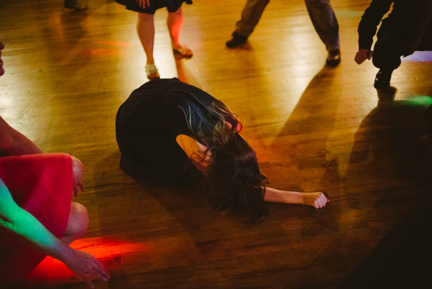 Guest dancing falls to wedding reception Pecan Springs Houston Texas photo by Philip Thomas Photography