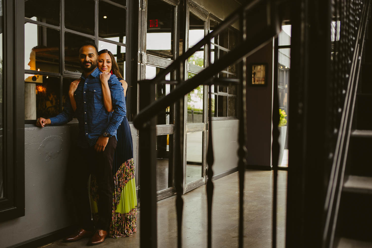 Couple hug engagement session at The Astorian Houston texas