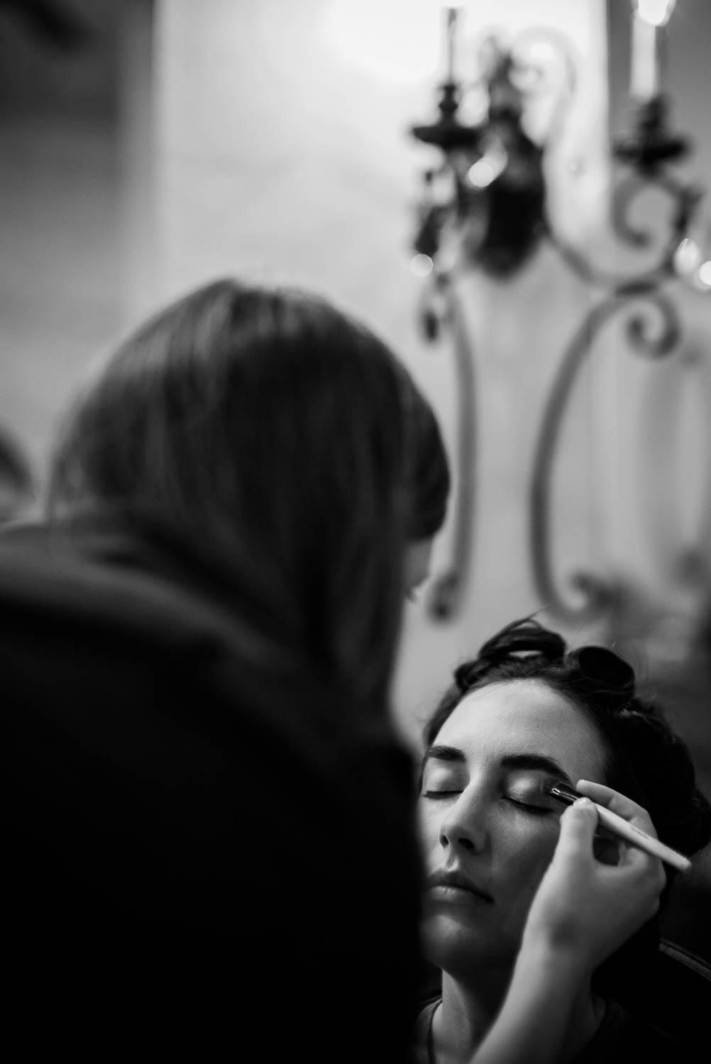 Image shows Bri the bride applying makeup Pecan Springs Houston Texas photo by Philip Thomas Photography