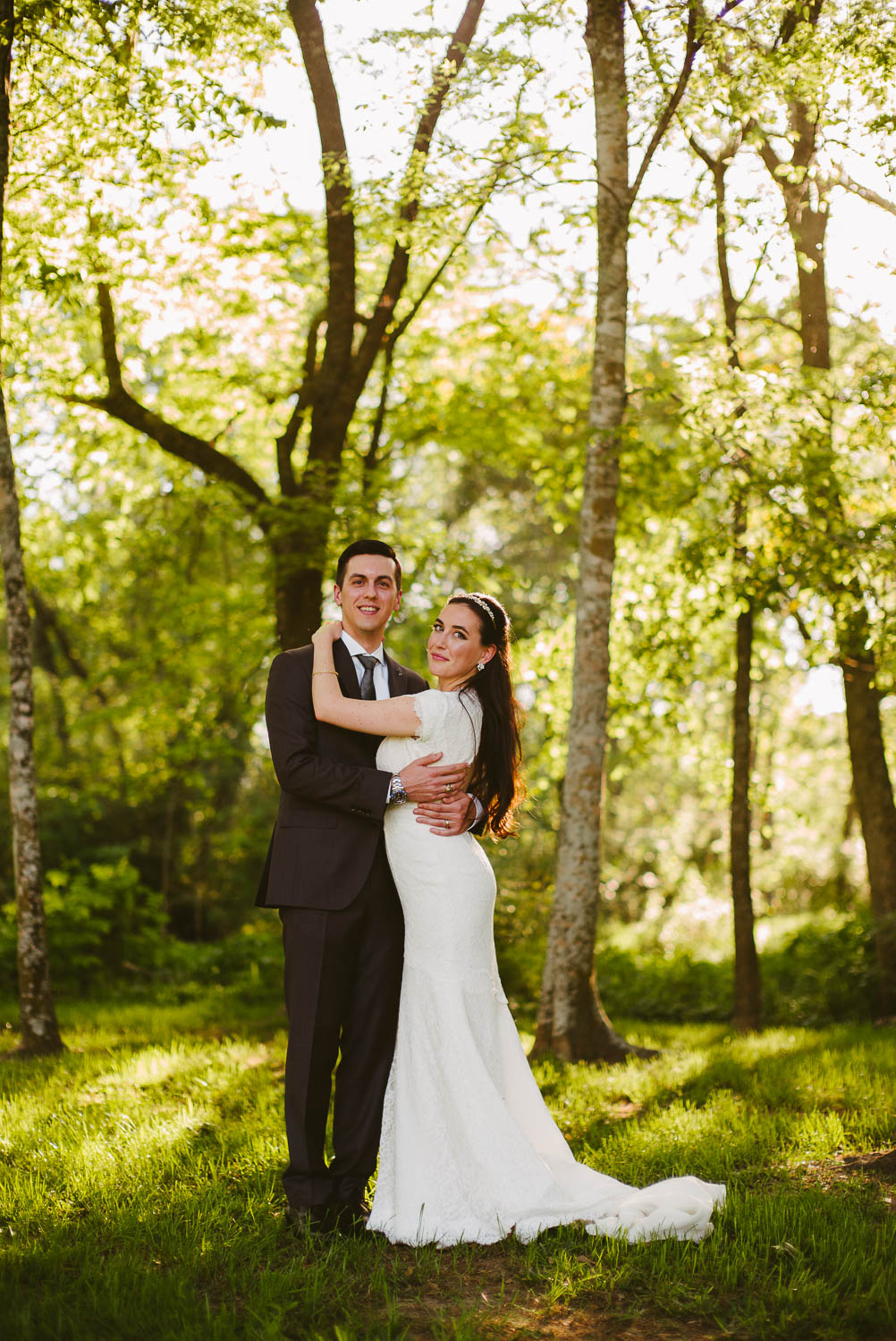 Couple after wedding ceremony pose in the woods at Pecan Springs Houston Texas photo by Philip Thomas Photography