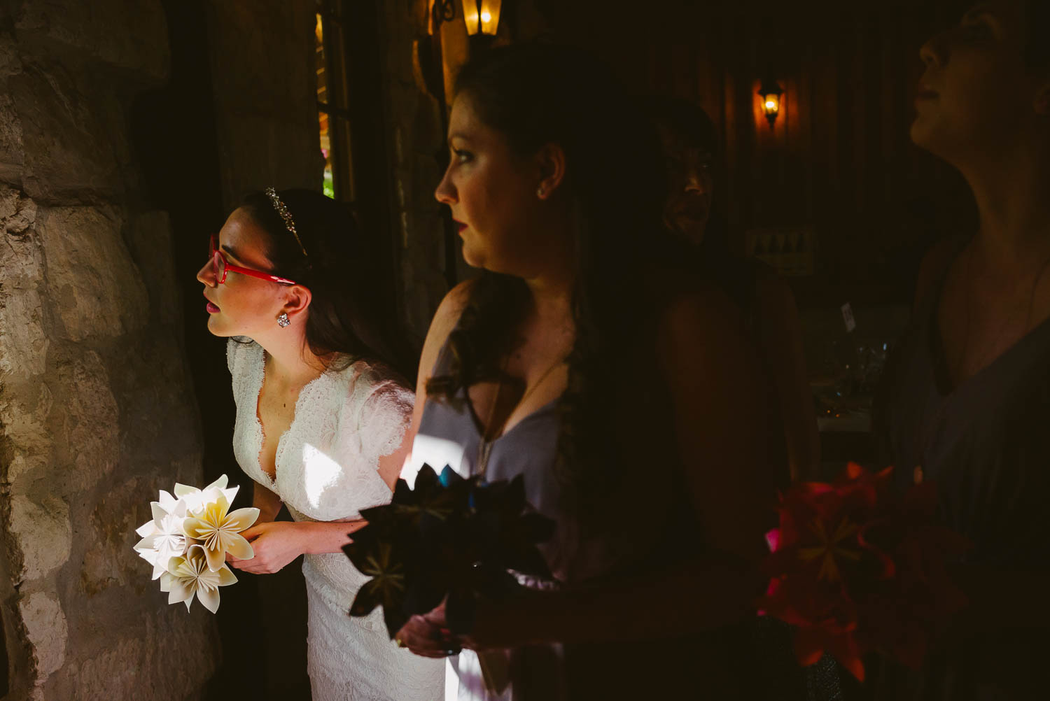 Bride check out the window and check son groom and wedding guests Pecan Springs Houston Texas photo by Philip Thomas Photography