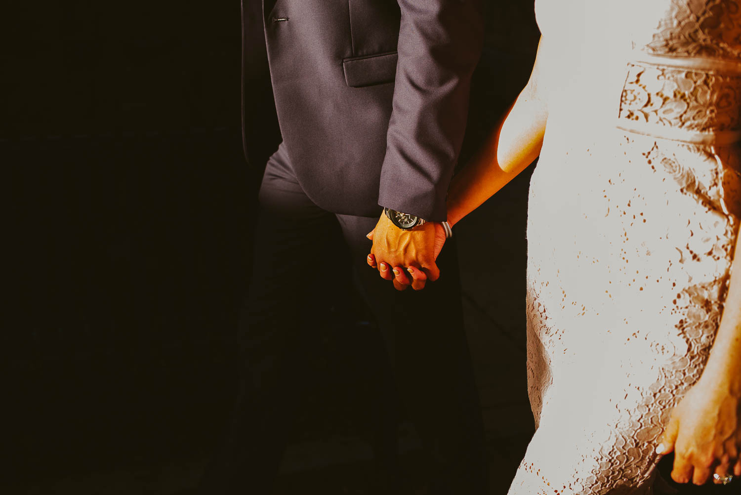 Couple holding hands along the streets of San Antonio Texas engagement shoot