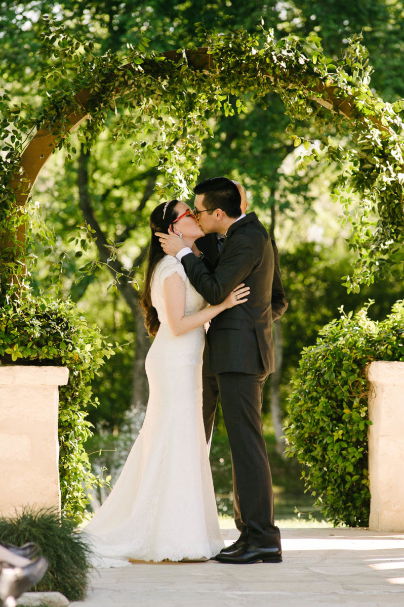 Bri and Max first kiss at Pecan Springs Houston Texas photo by Philip Thomas Photography