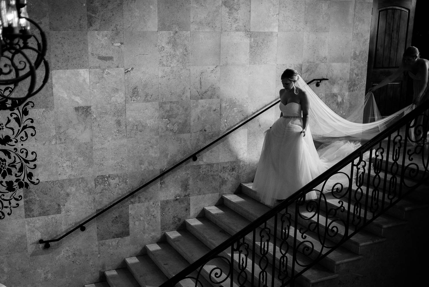Moments before the bridescends the staircase at Bell Tower on 34th Houston-Leica wedding photographer-Philip Thomas Photography