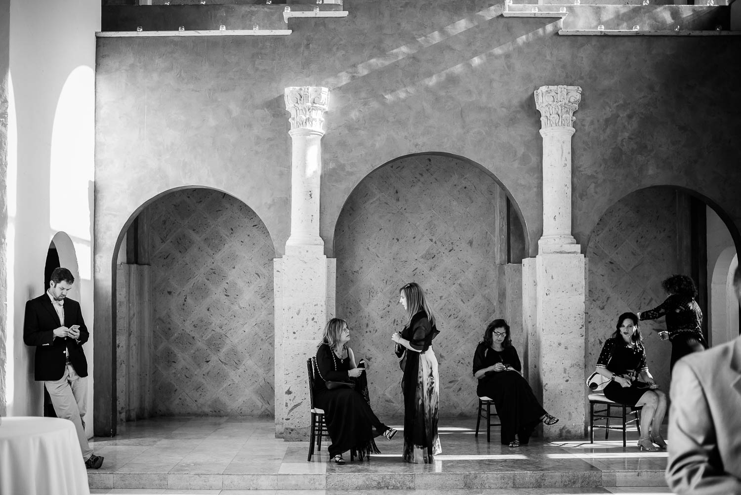 Guests at a wedding wait in the cocotail area before ceremony Bell Tower on 34th Houston-Leica wedding photographer-Philip Thomas Photography