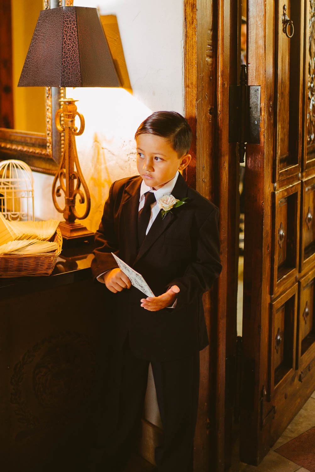 Ring bearer anxiously waits before the ceremony Bell Tower on 34th Houston-Leica wedding photographer-Philip Thomas Photography