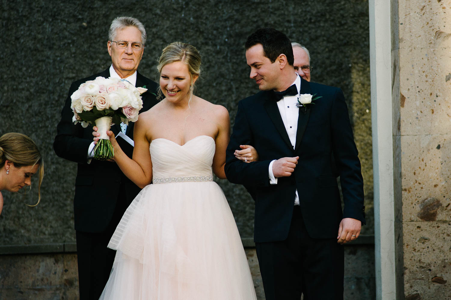 Rebecca and Luigi celebrate their italian style wedding walking down the aisle Bell Tower on 34th Houston-Leica wedding photographer-Philip Thomas Photography