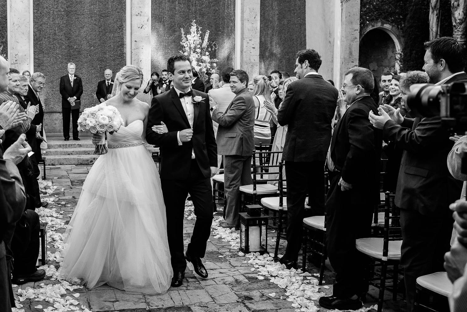 A couple married at Bell Tower on 34th Houston smiling and happy down the aisle Leica wedding photographer-Philip Thomas Photography