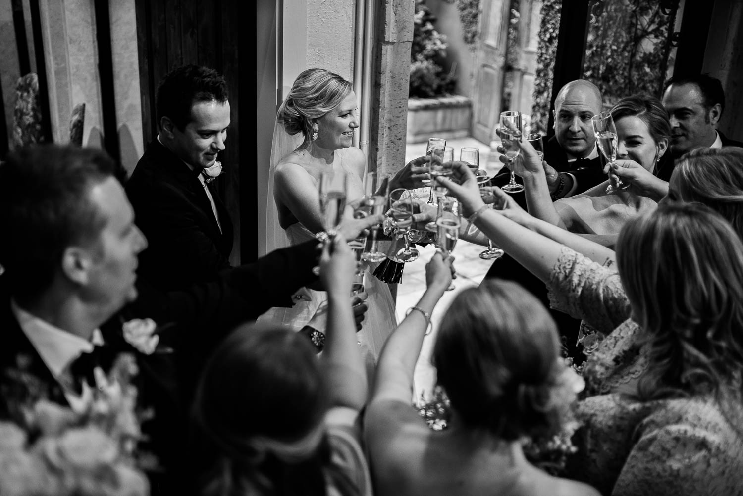 Friends celebrate surrounding the couple in a private toast Bell Tower on 34th Houston-Leica wedding photographer-Philip Thomas Photography