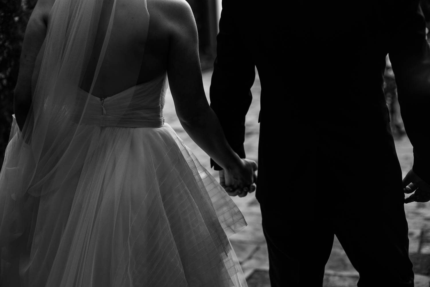 Couple holding hands Bell Tower on 34th Houston-Leica wedding photographer-Philip Thomas Photography