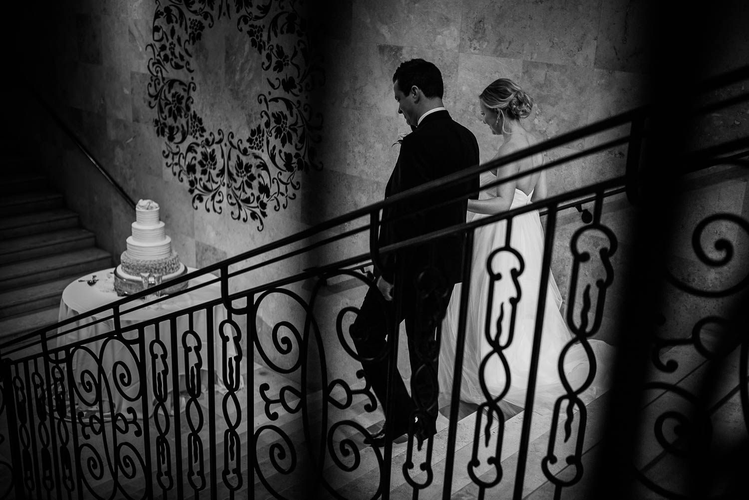 The Bell Tower 34th Couple descend a staircase as they're announced at a wedding reception, Houston-Leica wedding photographer-Philip Thomas Photography