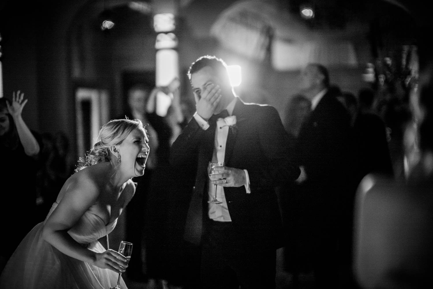 Couple laugh hysterically at wedding dancefloor -Bell Tower on 34th Houston-Leica wedding photographer-Philip Thomas Photography