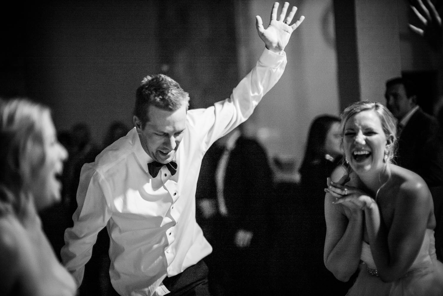 Brother of the bride dances manically much to the delight of the bride -Bell Tower on 34th Houston-Leica wedding photographer-Philip Thomas Photography