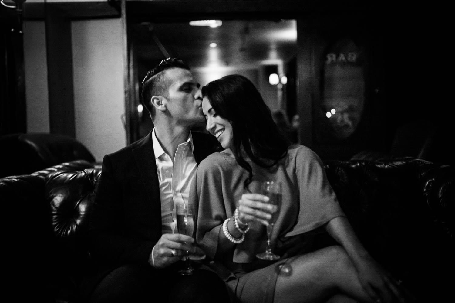 Inside the cozy Havana Hotel bar sit a couple beautiful black and white Downtown San Antonio Engagement photos-02