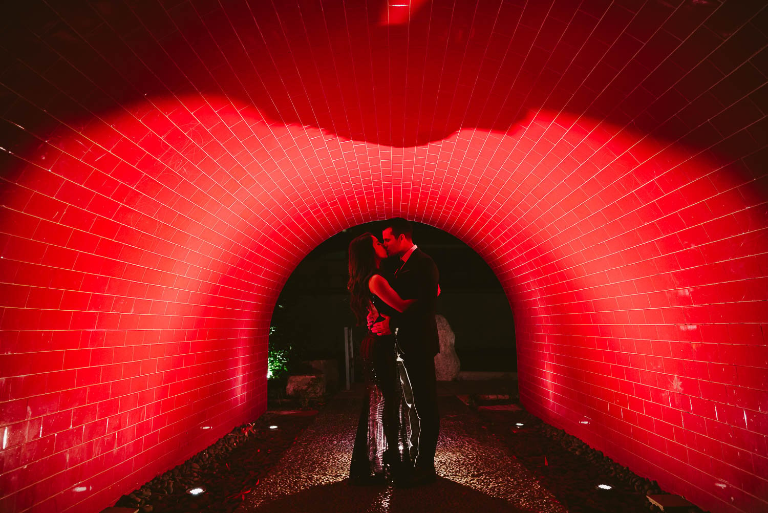 Couple embrace at the Red Tunnel Downtown San Antonio Engagement photos